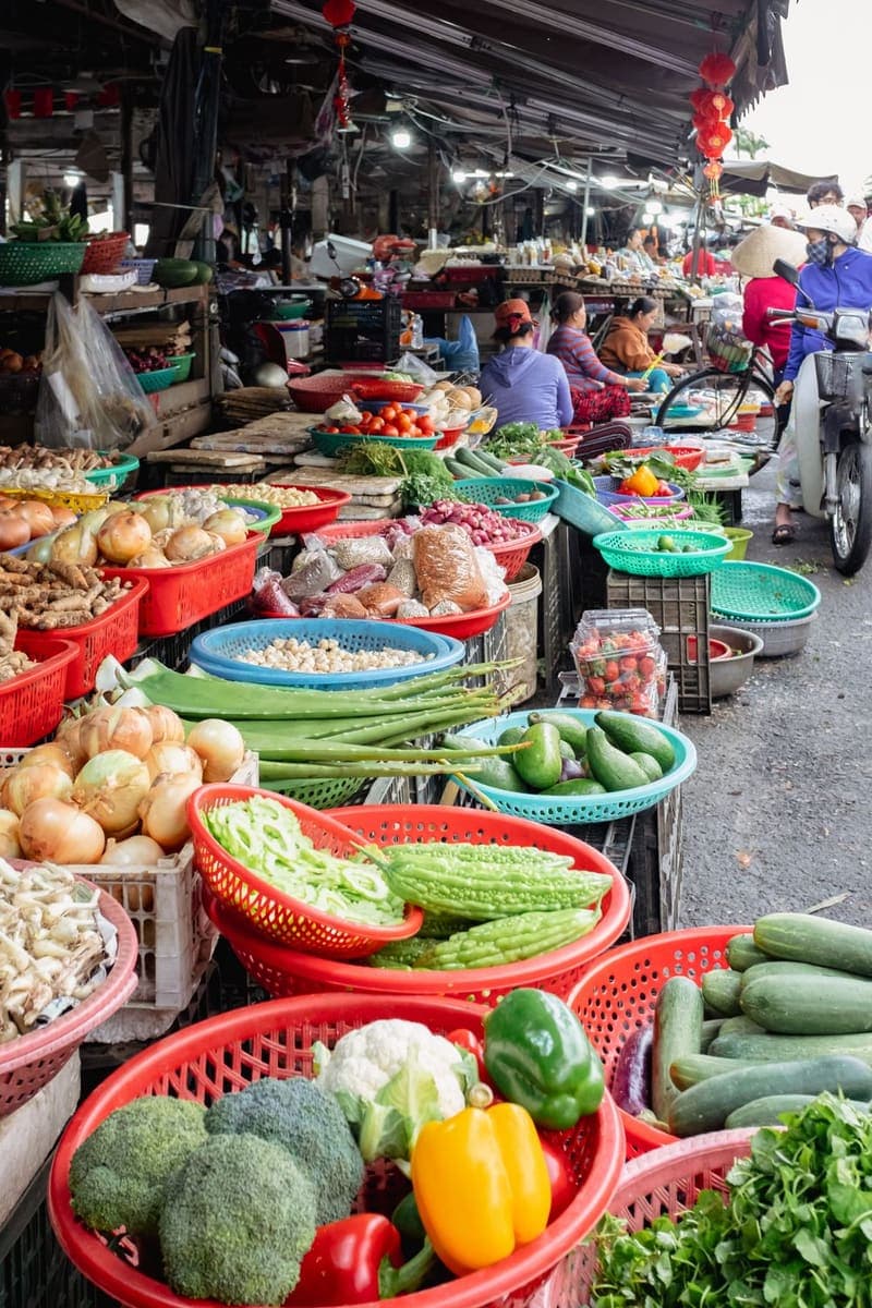 Baskets of vegetables lined up at a street market