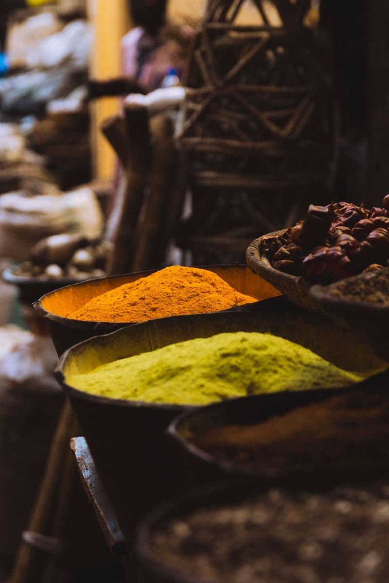 Bowls of ground spices at a bazar