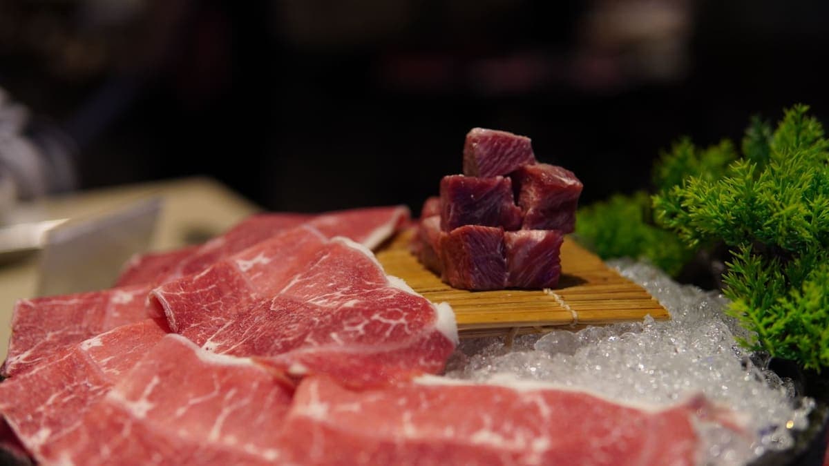 Cuts of raw meat chilled on ice