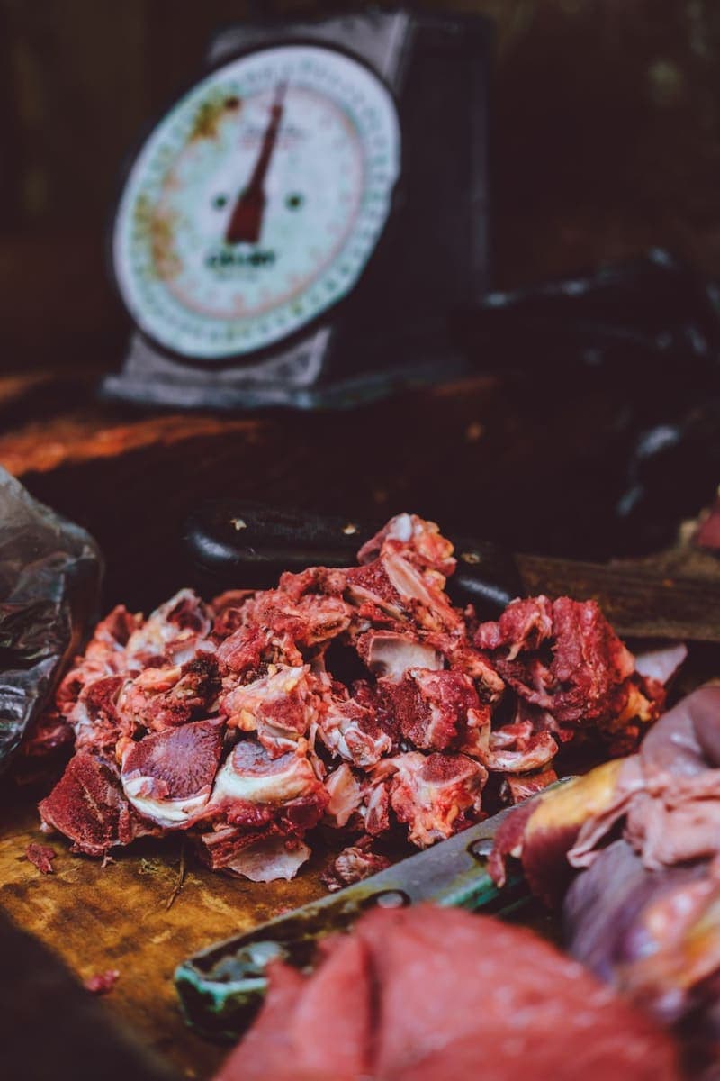 Fresh mutton beside a market scale